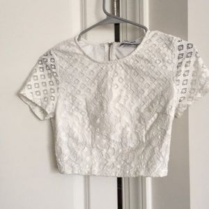 White lace dress, two piece. Crop top and skirt.